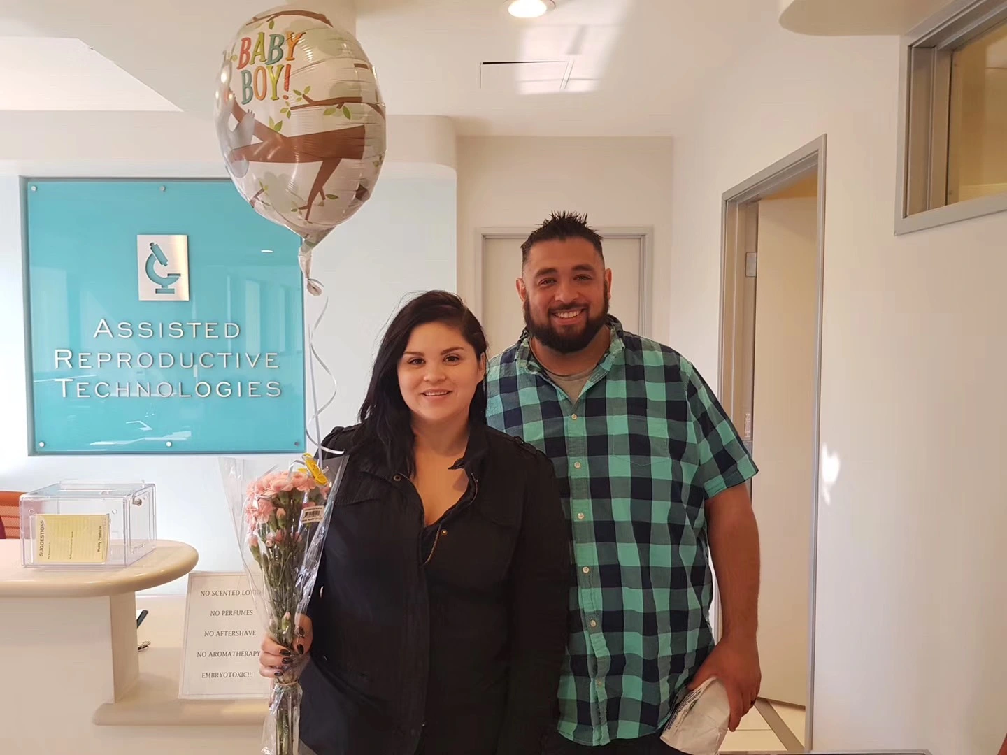 Intended parents visiting a fertility clinic during surrogacy planning
