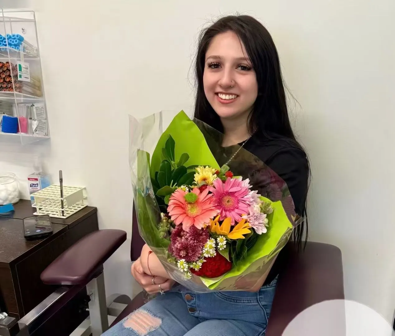 Woman celebrating a successful surrogacy milestone at a fertility clinic