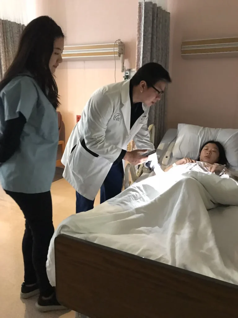 Surrogate receiving hospital care during medically ordered bed rest