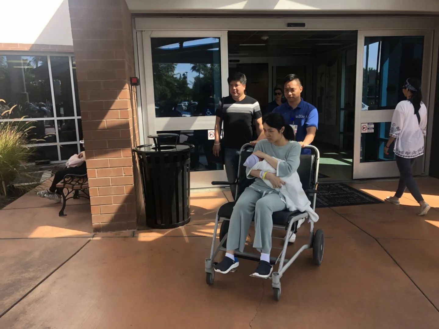 Surrogate leaving the hospital with support after delivery