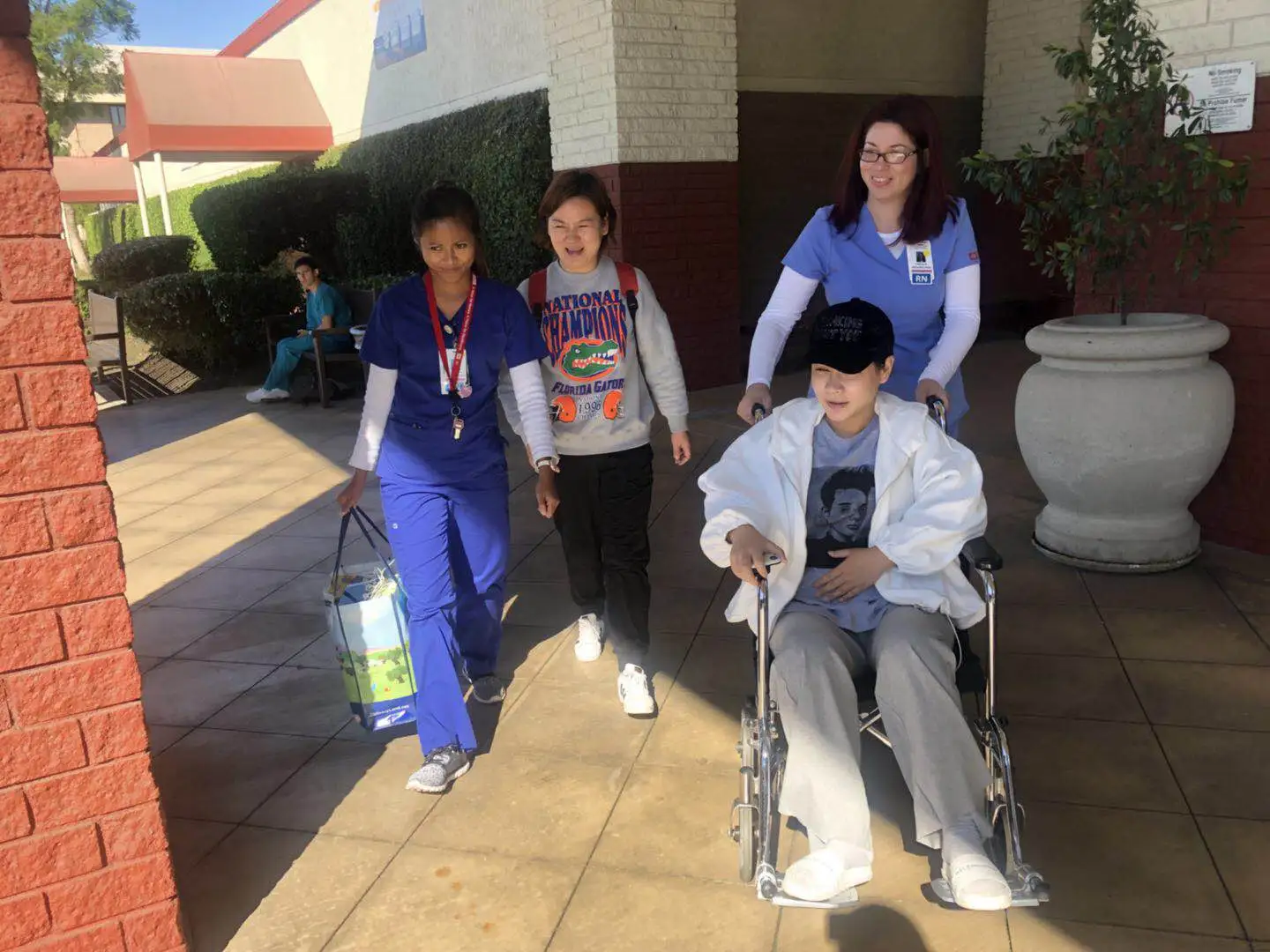 Surrogate and support person preparing to travel home after a medical visit