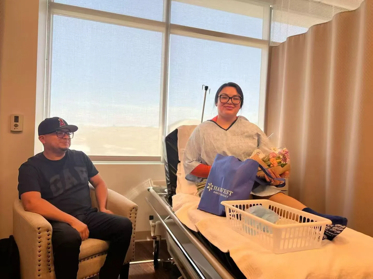 Surrogate recovering in the hospital after a C-section delivery