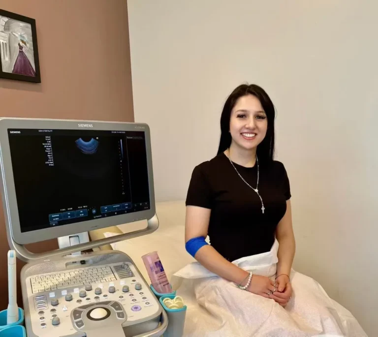 Prospective surrogate attending an ultrasound appointment during medical screening