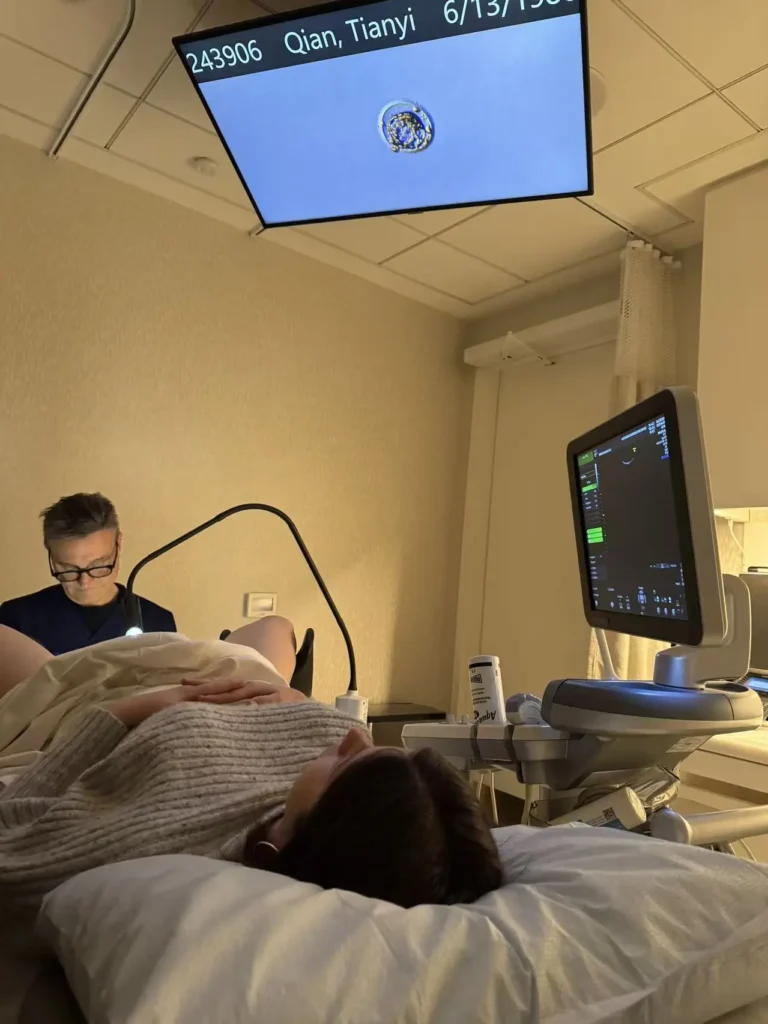 Surrogate attending an ultrasound appointment at a fertility clinic